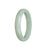 A beautiful light green jadeite bracelet with a half moon design, measuring 56mm in size. Perfect for adding a touch of elegance to any outfit.