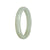 A close-up view of a genuine Grade A White Jadeite Jade Bangle, with a 56mm half moon shape, offered by MAYS GEMS.