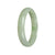 A beautiful light green jade bracelet in a half moon shape, measuring 56mm. Perfect for adding a touch of elegance and natural beauty to any outfit. Sold by MAYS.