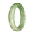 A light green traditional jade bracelet with a 58mm half moon shape.