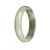 A beautiful white and green patterned Burma jade bangle bracelet, half moon shaped, crafted from genuine Grade A jade.