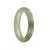 A beautiful half-moon shaped bracelet made of untreated light green and green Burma jade, with a diameter of 53mm.