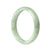 A beautiful half-moon shaped green jadeite bangle, 56mm in size, crafted with genuine natural jadeite by MAYS.