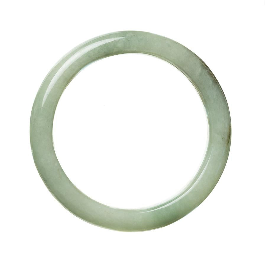 A close-up view of a beautiful green jade bangle with a semi-round shape, measuring 58mm. The jadeite jade used in this bangle is of the highest quality, known as Grade A. This exquisite piece of jewelry is made by MAYS™.