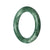 A round, Grade A Green Jade bangle bracelet, measuring 52mm in size. The bracelet is authentic and exudes elegance. Crafted by MAYS™.