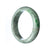A half moon-shaped grey green traditional jade bangle bracelet, with a 58mm diameter, made of real Type A jade.