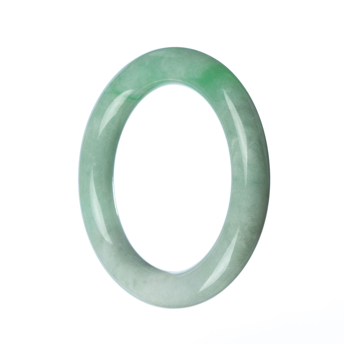 A close-up of a round, green jade bangle bracelet, with a smooth surface and a vibrant color.