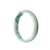 A close-up image of a pale green jadeite jade bracelet. The bracelet has a half moon shape and measures 57mm in diameter. It is certified as Grade A quality. The brand name "MAYS" is also mentioned.