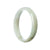 A close-up image of a white jadeite bangle in a half moon shape, measuring 54mm in diameter. The bangle appears to be made of high-quality, genuine grade A white jadeite. It has a smooth and polished surface, with a lustrous and elegant appearance. Perfect for adding a touch of sophistication to any outfit.