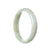 A close-up image of a white Burma jade bracelet, featuring a 54mm half moon shape. The bracelet is made of genuine grade A jade and is designed by MAYS™.